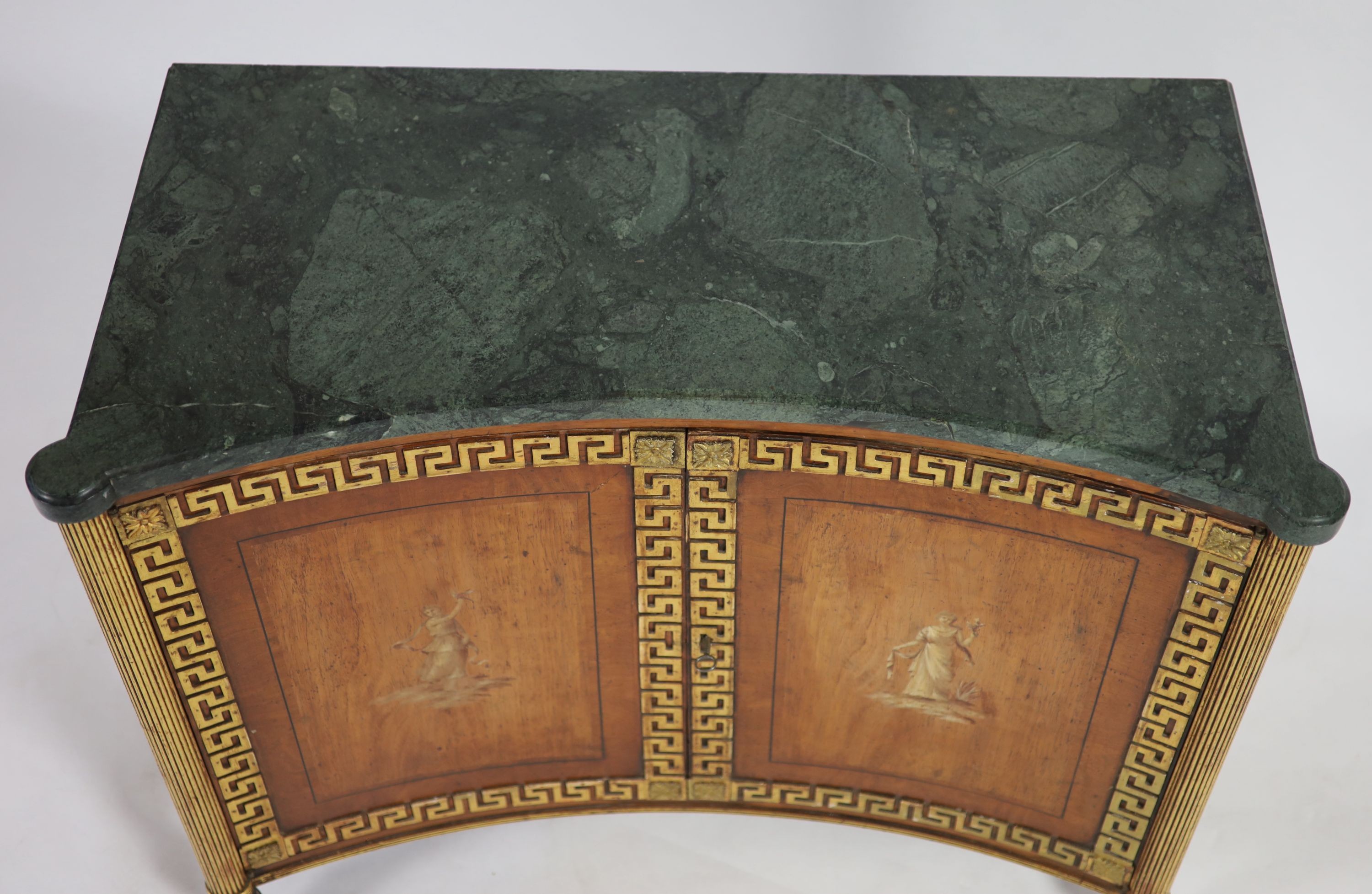 A Regency parcel gilt rosewood concave front side cabinet W.106cm D.52cm H.87cm